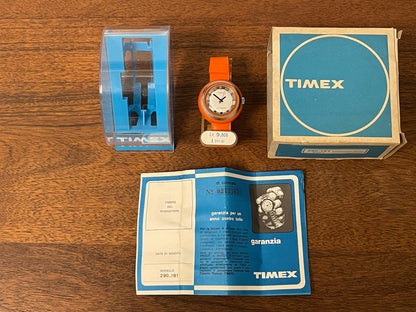(1970s) Timex 290-181 UFO - orange plastic case - white dial w/ silver markers - small size (NOS + full set)