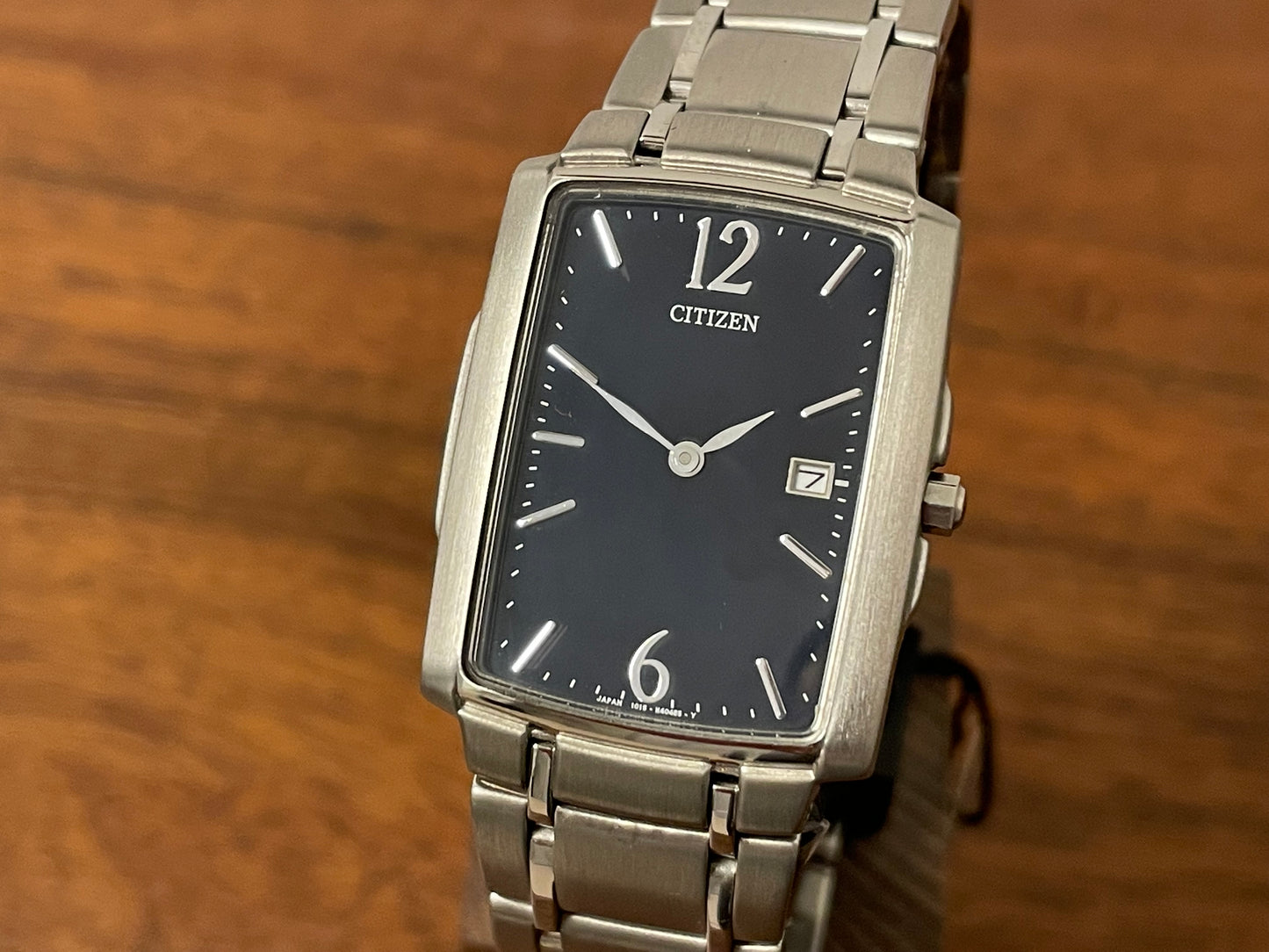 (1990) Citizen 1015-H23389 - integrated bracelet - black dial w/ silver Arabic numerals & markers (NOS)