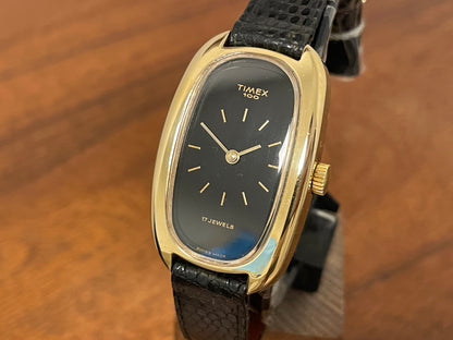 (1979) Timex 100 manual wind dress watch - Swiss made - tonneau case - black dial w/ gold markers