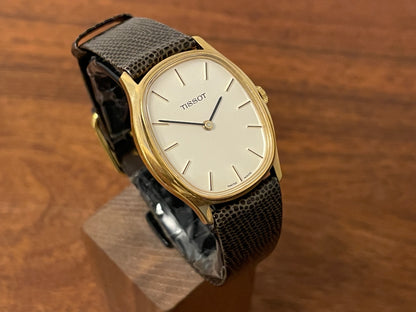 (1970s) Tissot 41141 "Ellipse" dress watch - gold case - silver brushed dial w/ gold stick markers (NOS)