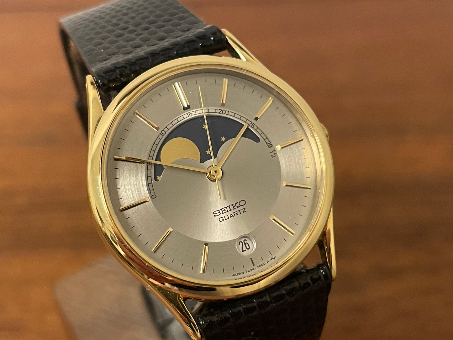 (1986) Seiko 7434-7000 dress watch with moon phase -silver dial w/ gold stick markers (NOS)