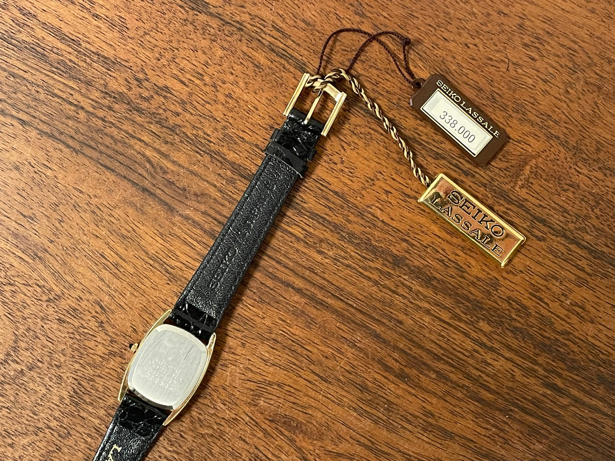 (1980) Seiko 1400-7249 Lassale "Ellipse" dress watch - black dial w/ gold Roman numerals - small size (NOS)