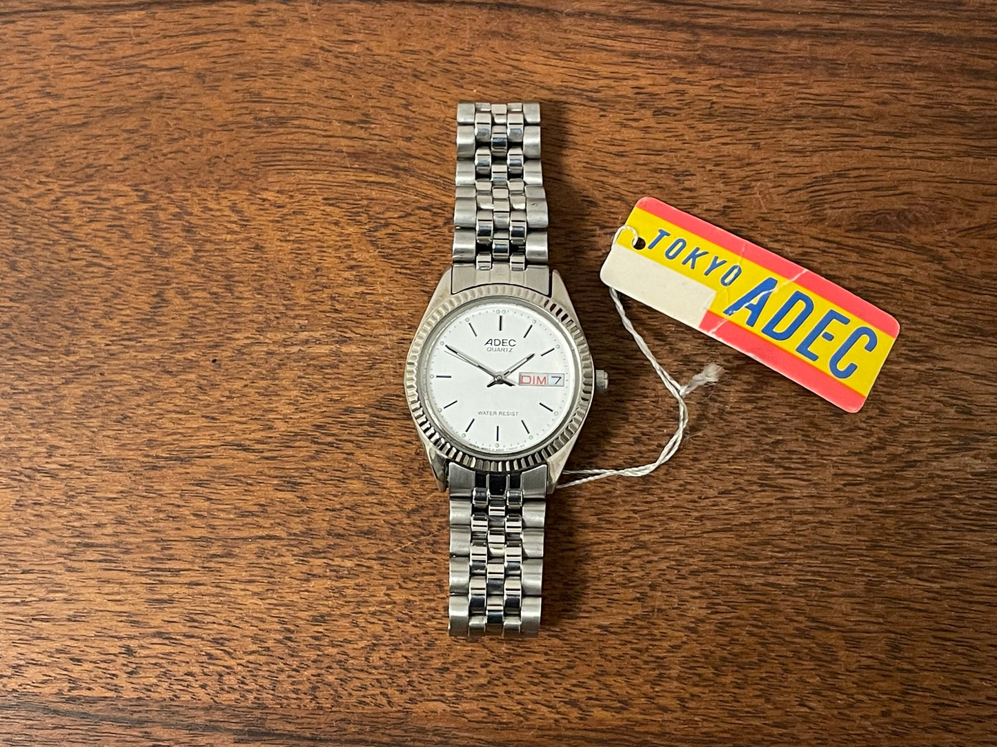 (1980) ADEC (by Citizen) "Day-Date" - fluted bezel - silver dial w/ stick markers - small size (NOS)
