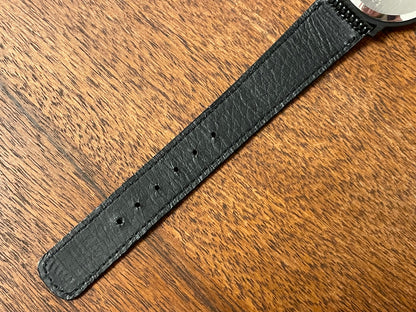 (1993) Seiko 6530-5120 dress watch- oval black case w/ gold bezel en hands (NOS)