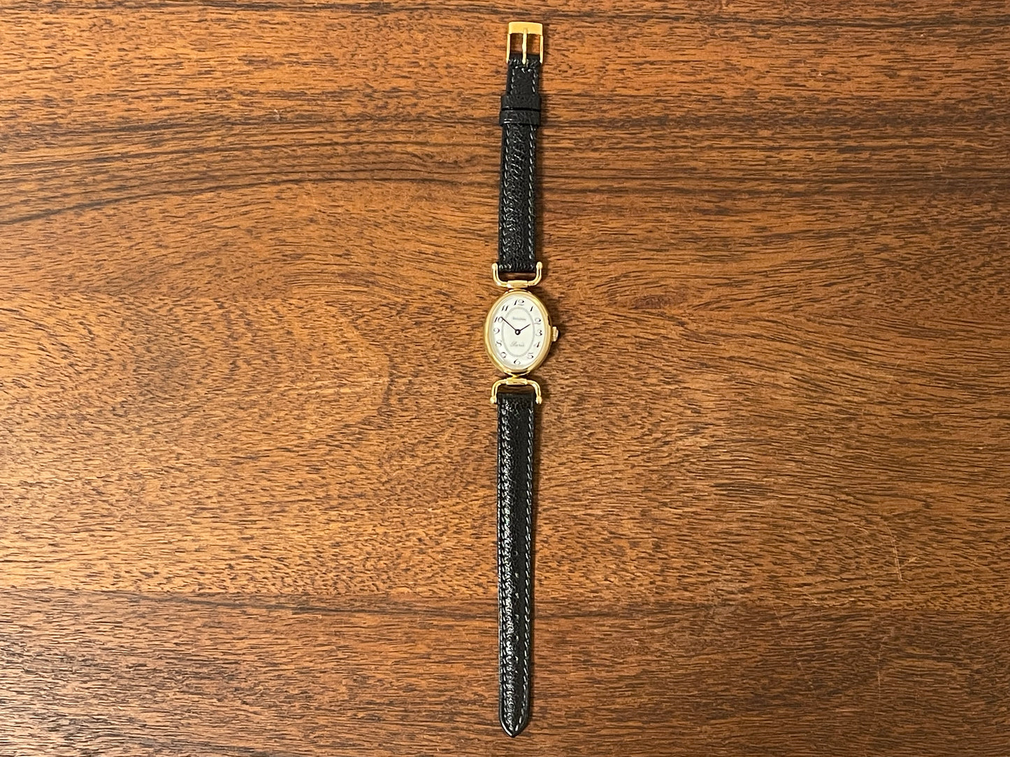 (1980s/1990s) Bulova Paris dress watch - oval case - cream dial w/ black Arabic numerals - small size (NOS)