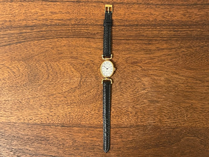 (1980s/1990s) Bulova Paris dress watch - oval case - cream dial w/ black Arabic numerals - small size (NOS)