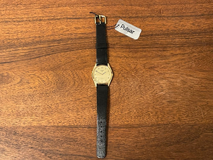 (1991) Pulsar Y480-0460 dress watch - gold colored case - matt champagne dial w/ black Arabic numerals - (NOS)