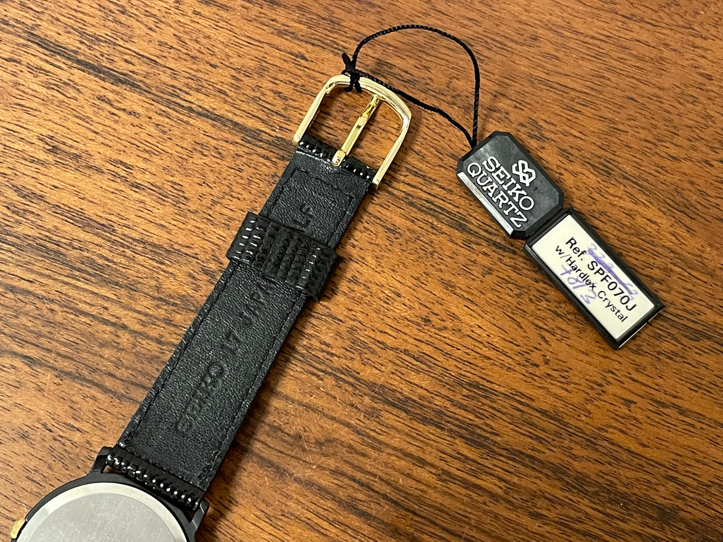 (1993) Seiko 6530-5120 dress watch- oval black case w/ gold bezel en hands (NOS)