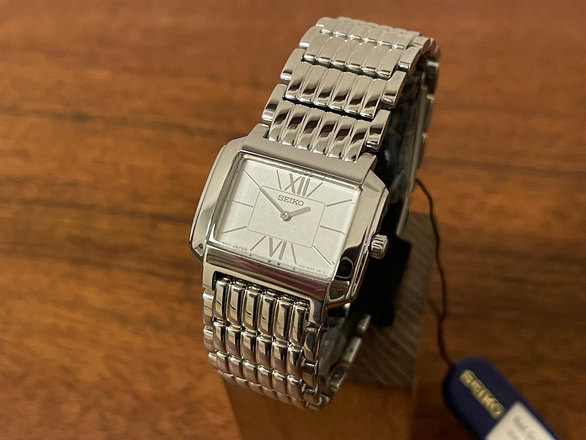 Front size (1998) Seiko 1N00-0PT0 - rectangular case - silver dial w/ silver Roman numerals & markers - small size (NOS)