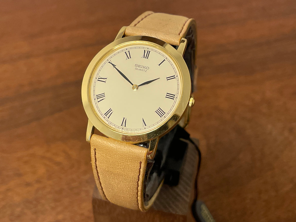 Front side (1989) Seiko 5Y94-8000 dress watch - gold case - cream dial w/ black Roman numerals (NOS)