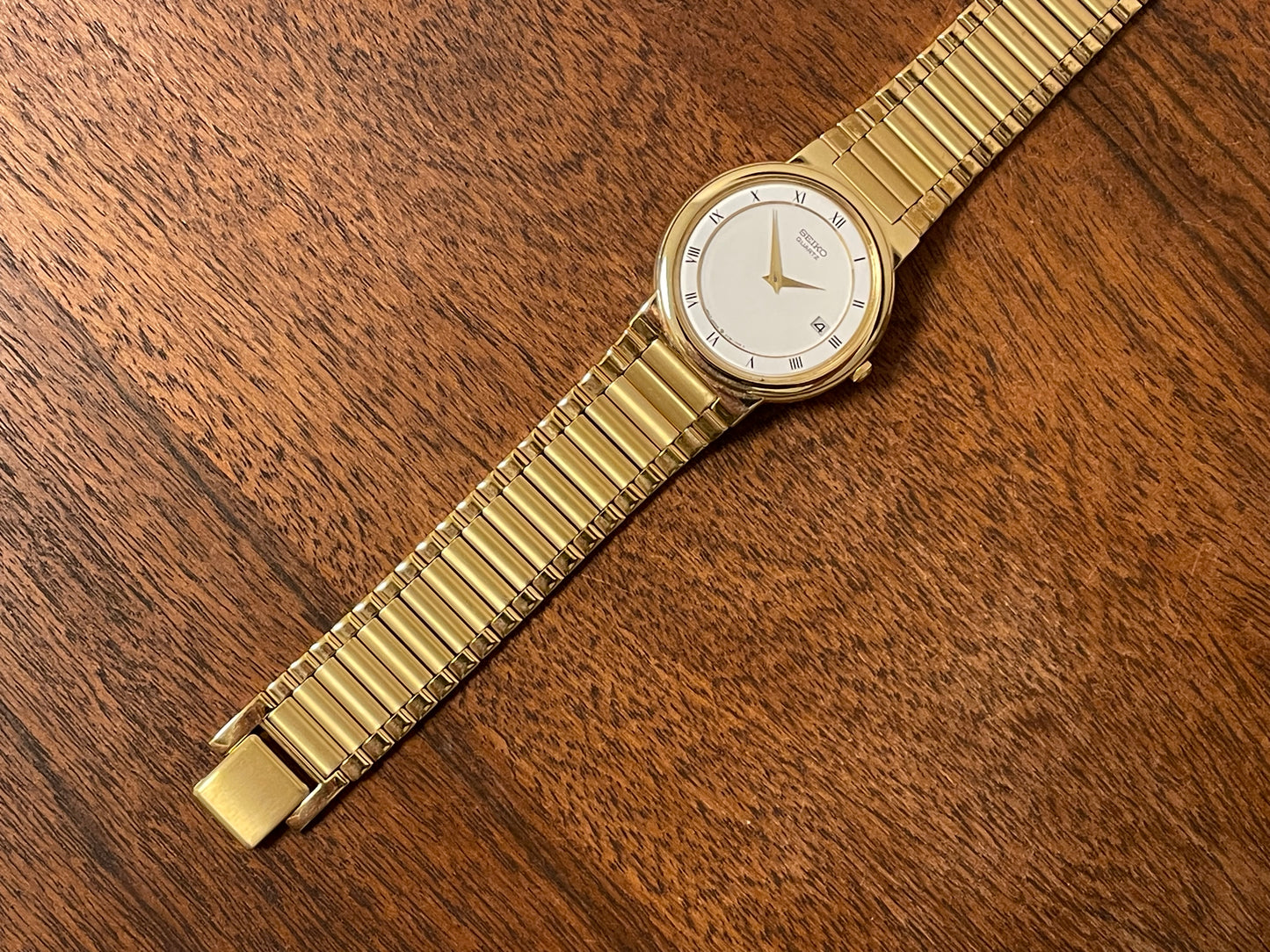 (1992) Seiko 5Y89-7A10 dress watch – white dial w/ Roman numerals & date (NOS)