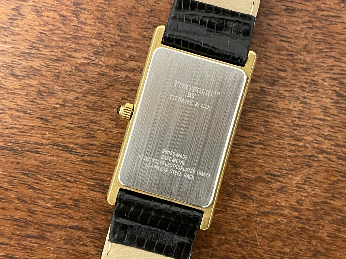 (1998) Tiffany & Co. Portfolio "Tank" dress watch - gold case - white dial w/ black Roman numerals (Mint)