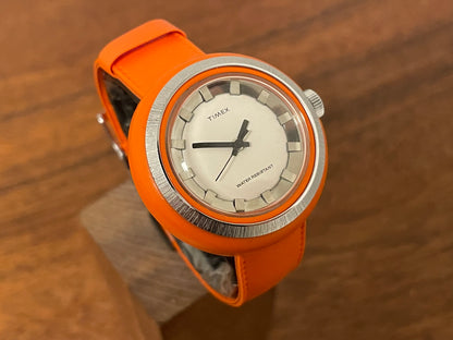 (1970s) Timex 290-181 UFO - orange plastic case - white dial w/ silver markers - small size (NOS + full set)