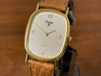 (1985) Pulsar V320-5029 "Ellipse" dress watch - gold case - diamond dust dial (NOS)