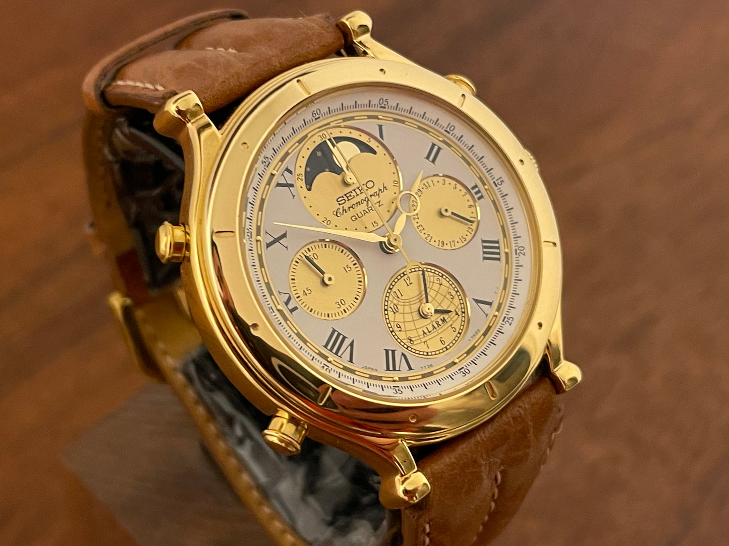 (1990) Seiko 7T36-7A10 Age of Discovery (AOD) chronograph - gold colored case - white dial w/ gold subdials & moonphase