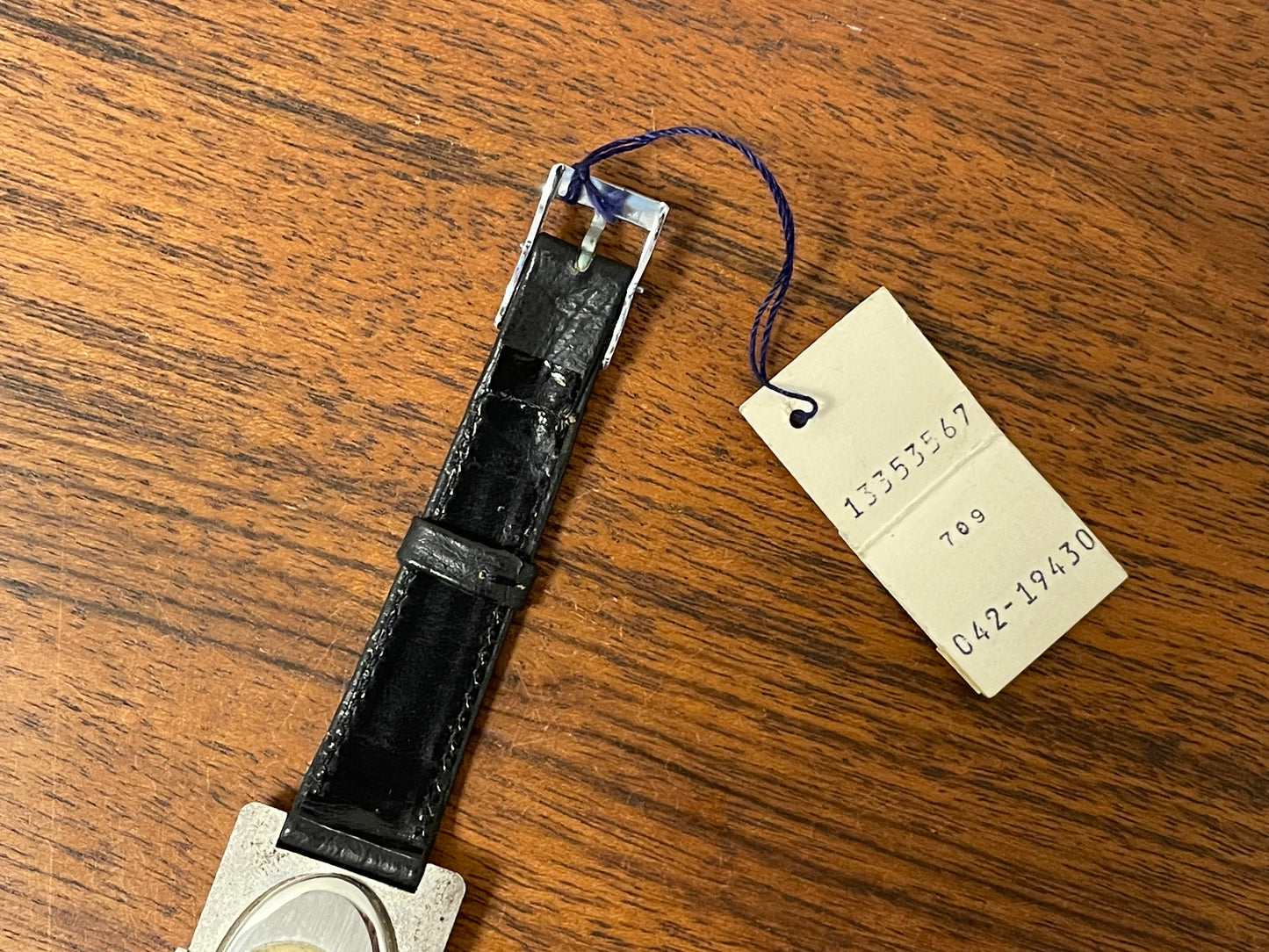 (1970s) Tissot Stylist "Tank" - decorated case - black sunburst dial w/ white Roman numerals - small size (NOS)