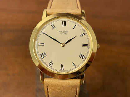 (1989) Seiko 5Y94-8000 dress watch - gold case - cream dial w/ black Roman numerals (NOS)