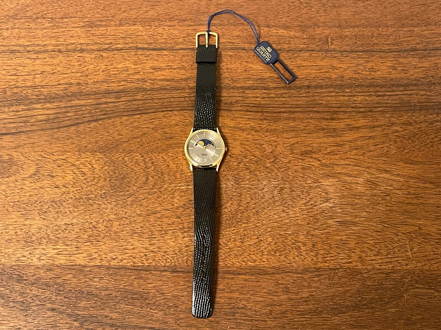 (1986) Seiko 7434-7000 dress watch with moon phase -silver dial w/ gold stick markers (NOS)