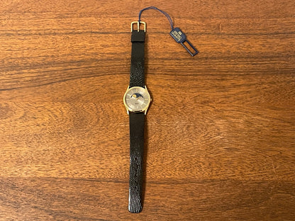 (1986) Seiko 7434-7000 dress watch with moon phase -silver dial w/ gold stick markers (NOS)