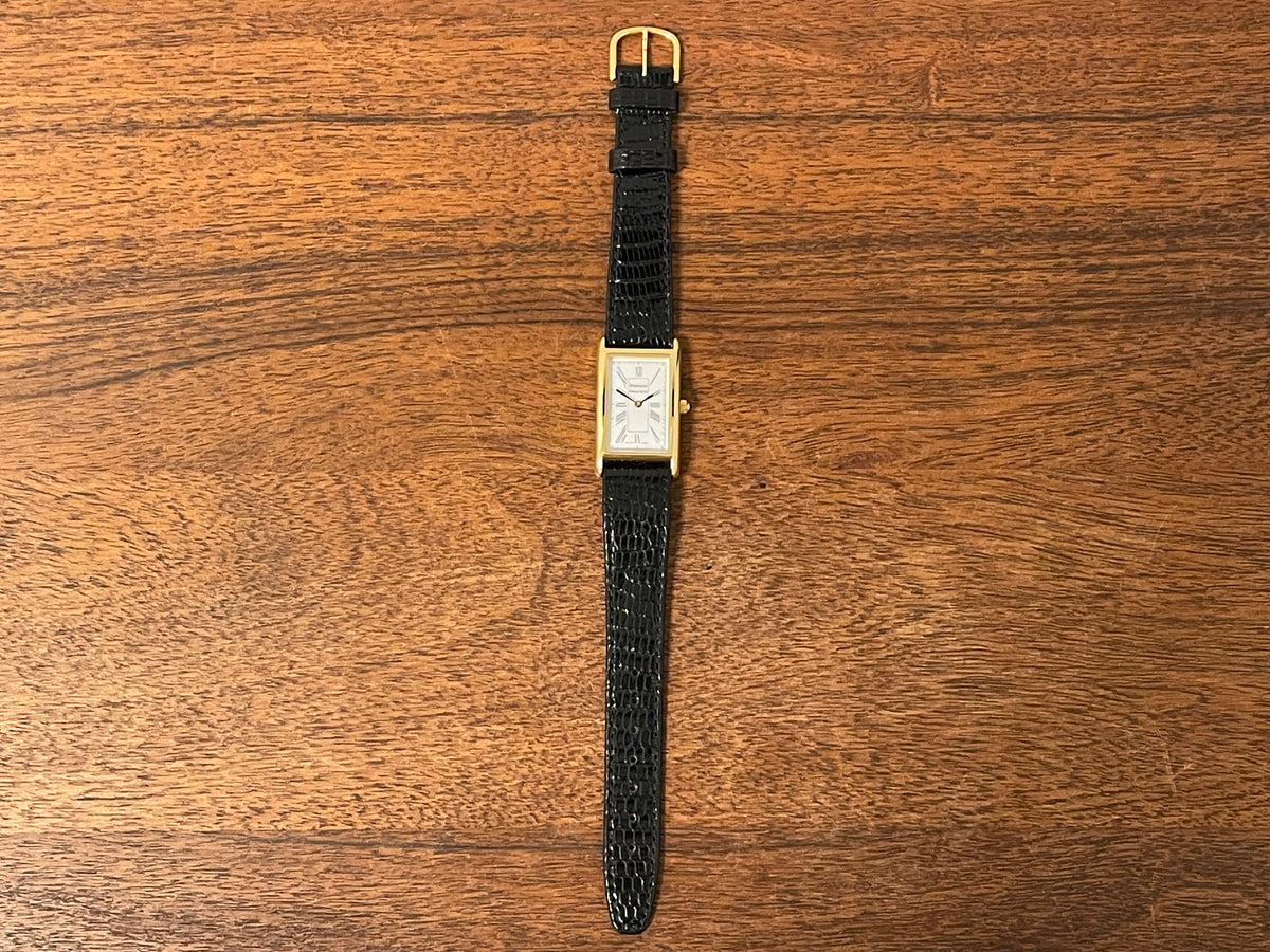 (1998) Tiffany & Co. Portfolio "Tank" dress watch - gold case - white dial w/ black Roman numerals (Mint)
