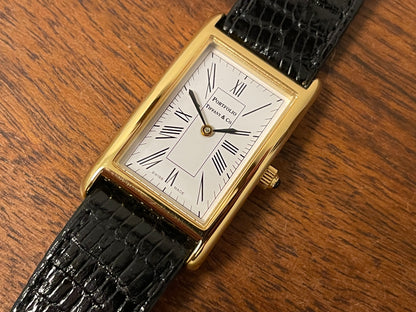 (1998) Tiffany & Co. Portfolio "Tank" dress watch - gold case - white dial w/ black Roman numerals (Mint)