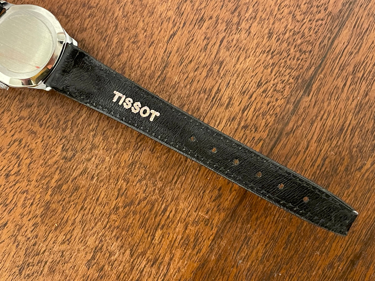 (1970s) Tissot 052-15007 Stylist dress watch - silver cushion case - silver brushed dial w/ silver stick markers - small size (NOS)