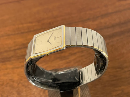 (1983) Seiko 6730-565H Lassale ultra thin - stainless steel bracelet - brushed gold dial w/ black stick markers (NOS)