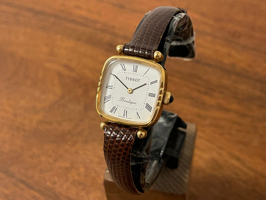 Front side (1970s) Tissot Boutique dress watch - white dial w/ black Roman numerals - small size (NOS)