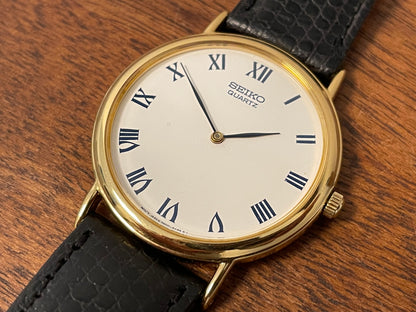 (1991) Seiko 7N00-8A00 dress watch - white dial w/ Roman numerals & Leafe hands (NOS)