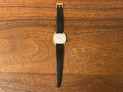 (1970s) Tissot Stylist dress watch - gold “tv case” - white dial w/ black Roman numerals (NOS)