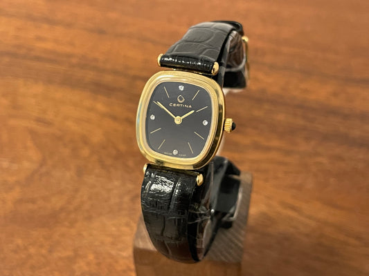 Front side (1970s) Certina 7065SP dress watch - gold plated case - black dial w/ diamond markers - small size (NOS)