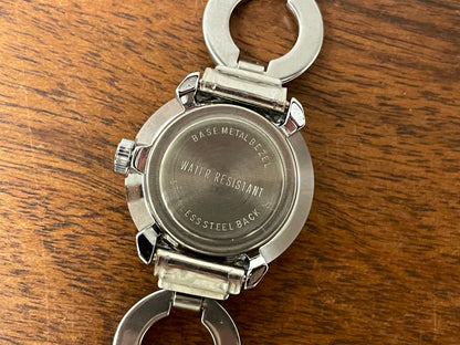 (1970s) Timex 551-125 dress watch - silver case - brown dial w/ silver markers - small size (NOS + full set)