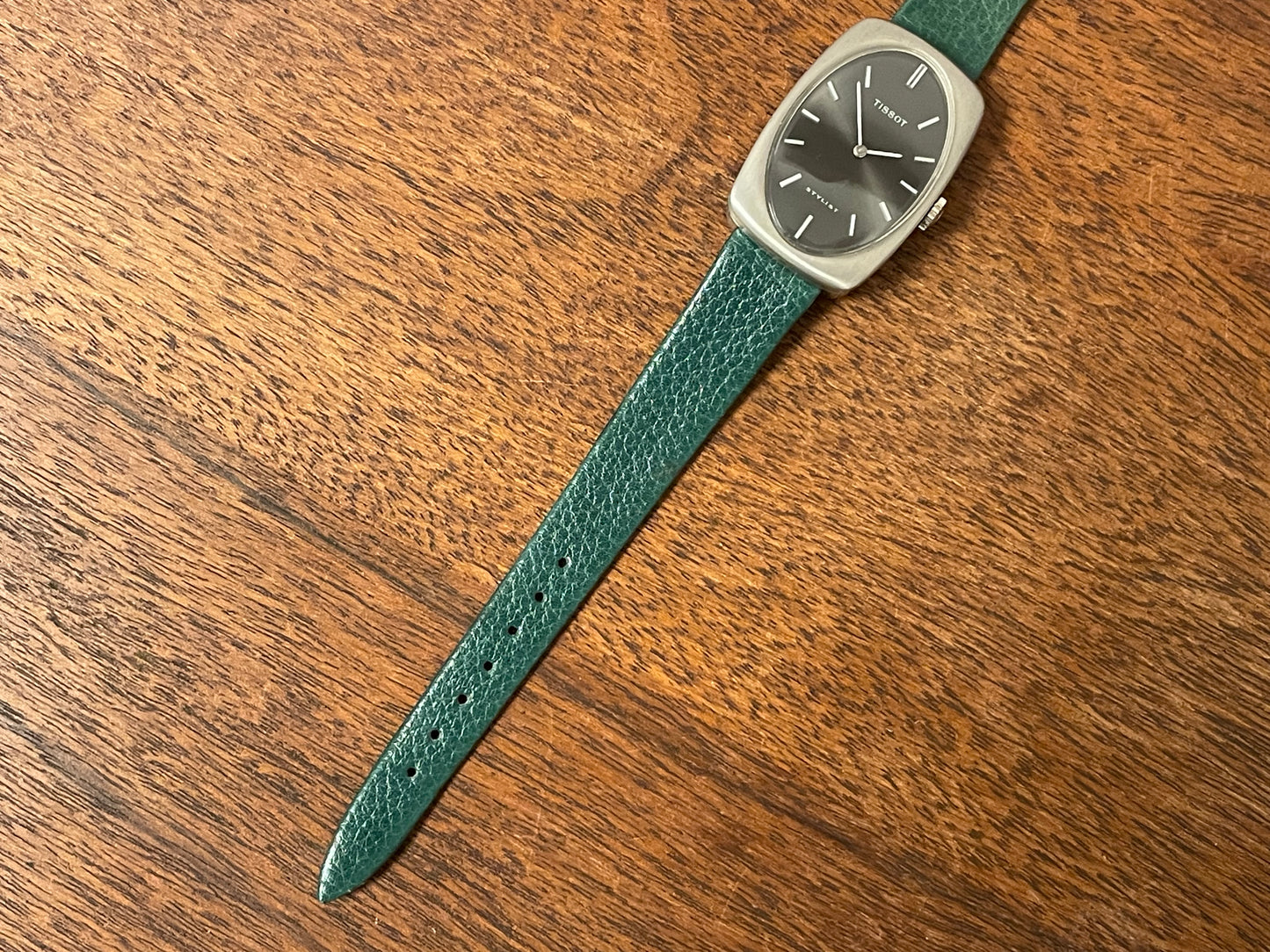 (1970s) Tissot Stylist dress watch - oval grey sunburst dial w/ white stick markers - small size (NOS)