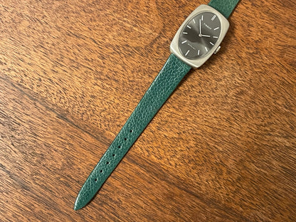 (1970s) Tissot Stylist dress watch - oval grey sunburst dial w/ white stick markers - small size (NOS)