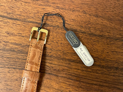 (1992) Seiko 7N00-6A00 dress watch - white dial w/ Roman numerals & Spade hands (NOS)
