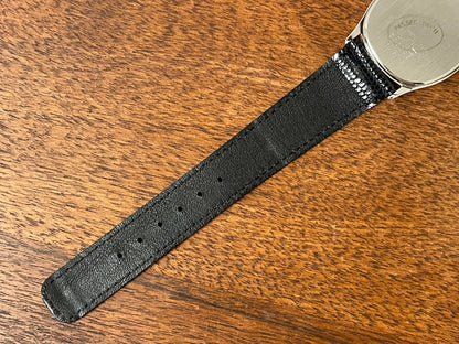 (1982) Pulsar Y112-5099 "Ellipse" dress watch - silver case - black dial w/ silver stick markers (NOS)