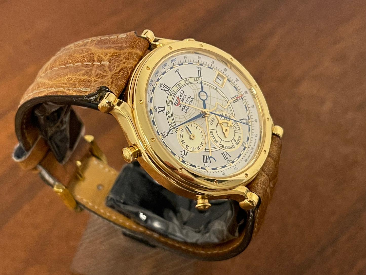 (1994) Seiko 6m13-0010 Age of Discovery (AOD) Perpetual Calendar - gold colored case - white dial w/ black Roman numerals