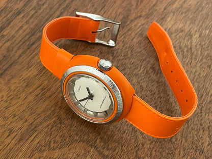 (1970s) Timex 290-181 UFO - orange plastic case - white dial w/ silver markers - small size (NOS + full set)