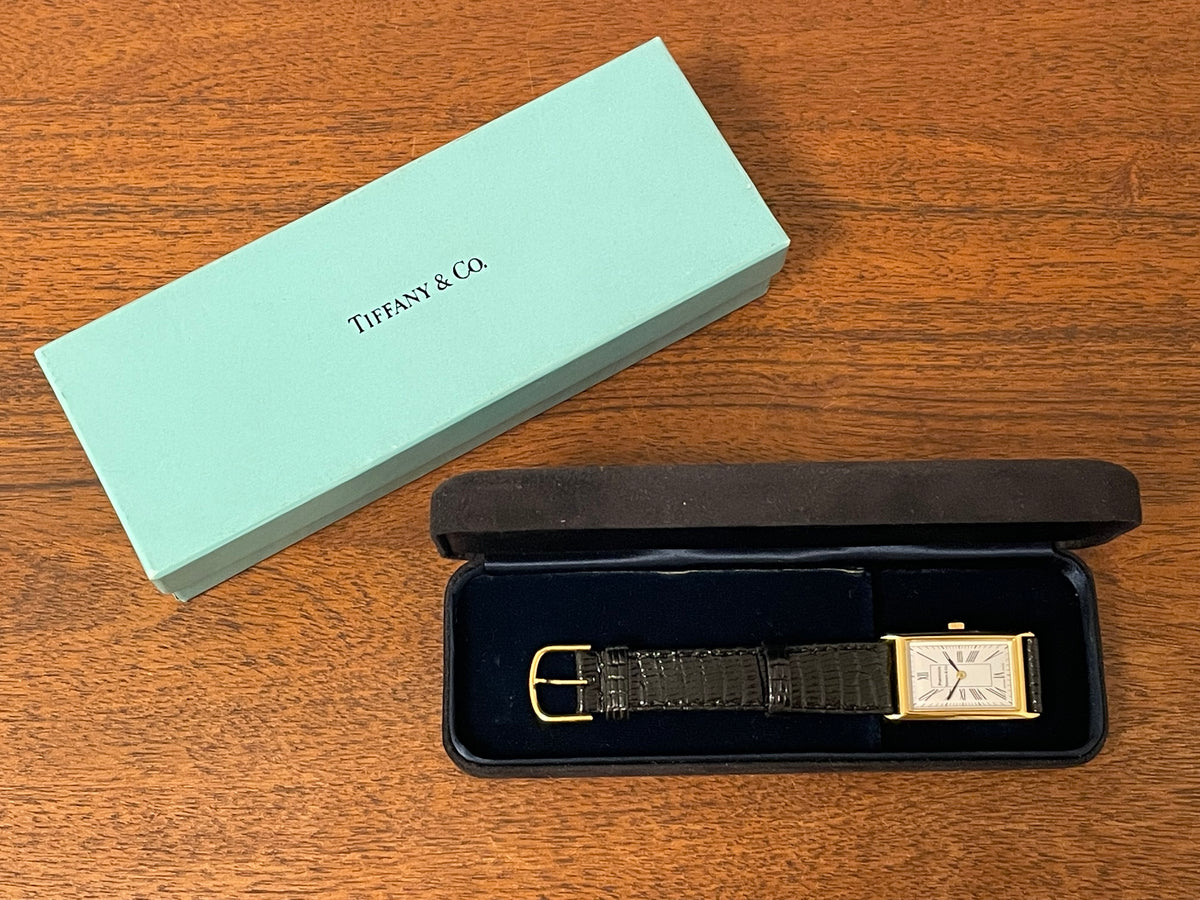 (1998) Tiffany & Co. Portfolio "Tank" dress watch - gold case - white dial w/ black Roman numerals (Mint)