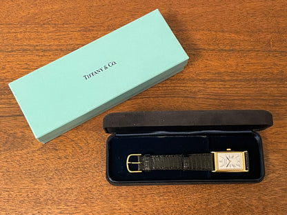 (1998) Tiffany & Co. Portfolio "Tank" dress watch - gold case - white dial w/ black Roman numerals (Mint)