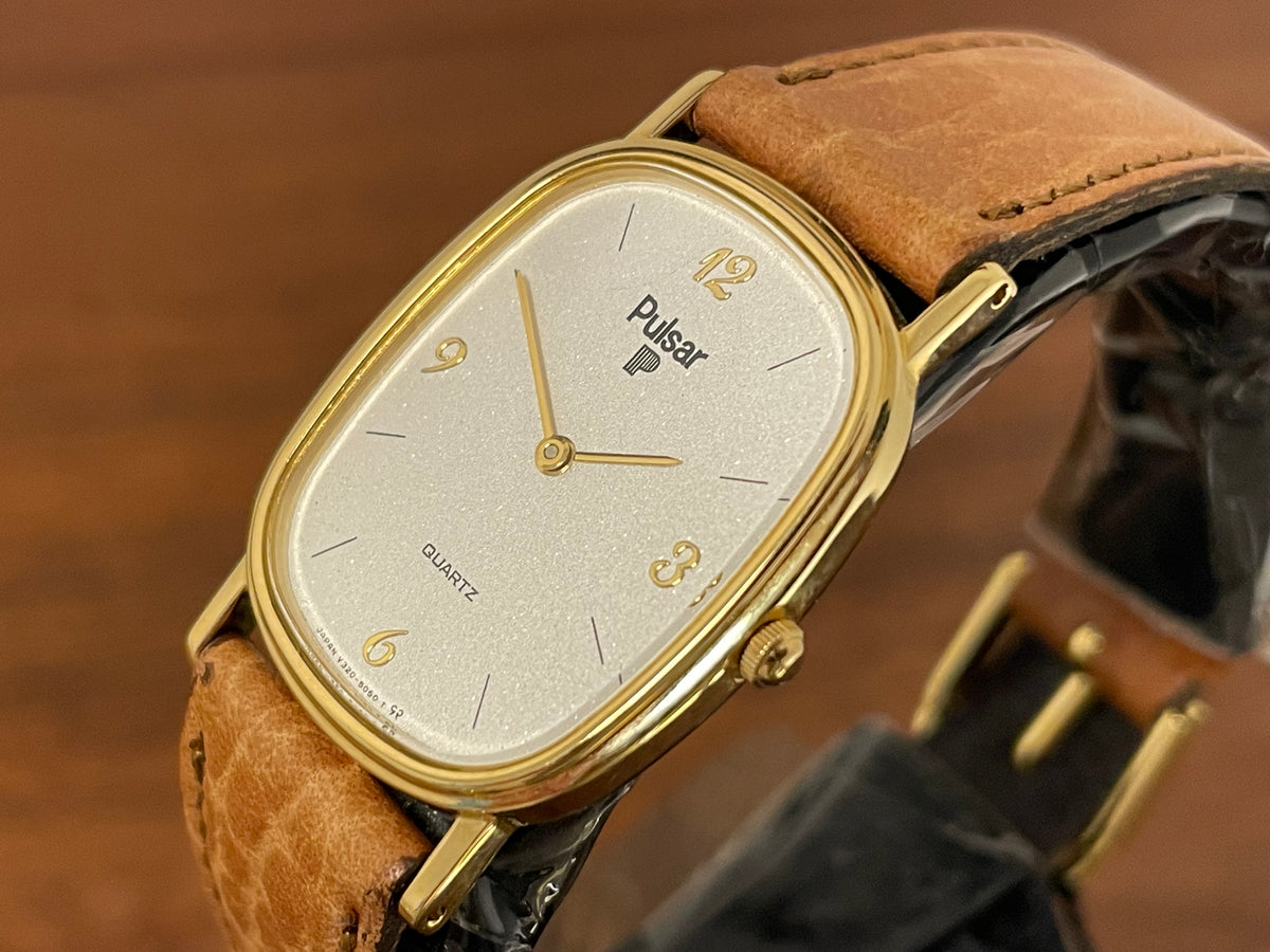 (1985) Pulsar V320-5029 "Ellipse" dress watch - gold case - diamond dust dial (NOS)
