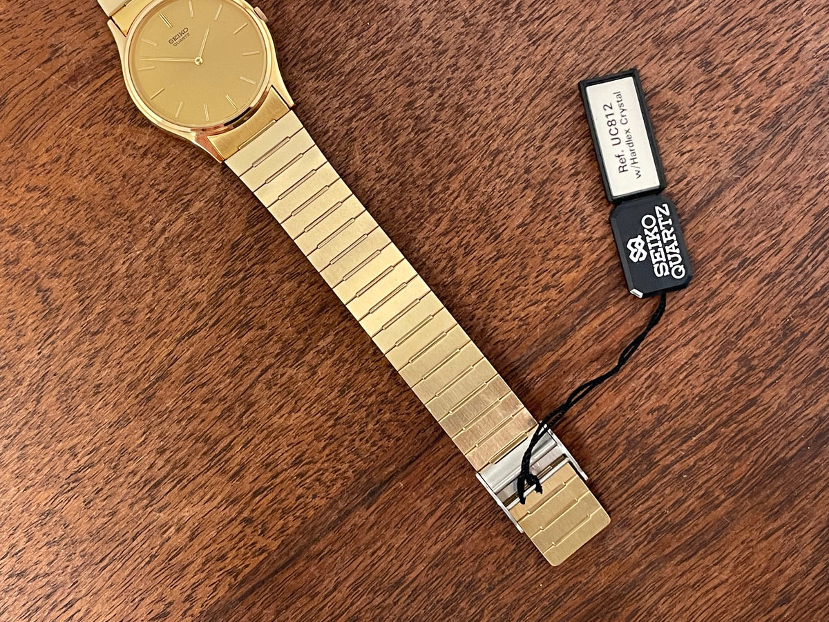 (1983) Seiko 8420-0140 dress watch - gold case - gold sunburst dial w/ gold stick markers (NOS)