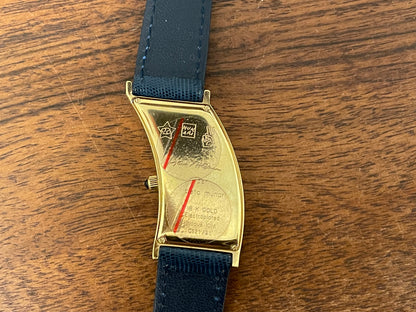 (1991) Cleto Munari "Parentesi" by Hans Hollein - asymmetrical 18K gold electroplated case - blue enamel dial  (NOS + full set)