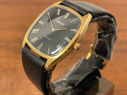 (1970s) Tissot Stylist dress watch - gold case - black dial w/ gold Roman numerals (NOS)