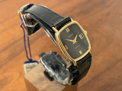 (1980s) Tissot 642.33500/5 Stylist "Ellipse" dress watch - gold case - black dial w/ Roman numerals - small size (NOS)