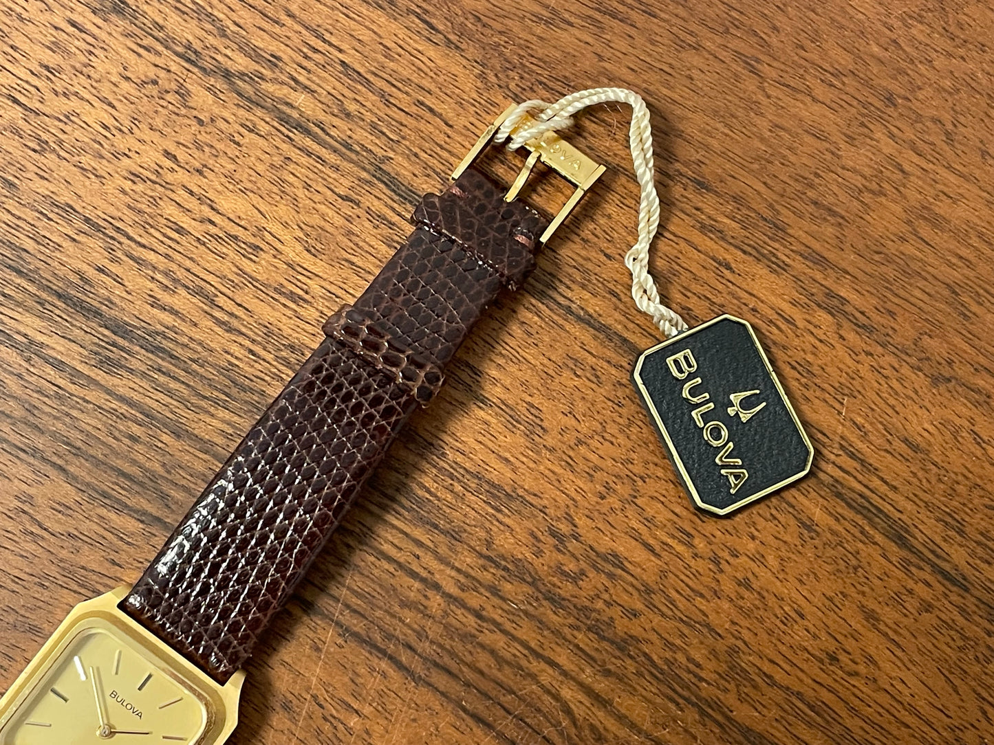(1982) Bulova Longchamp "Tank" dress watch - gold case w/ champagne dial - small size (NOS)