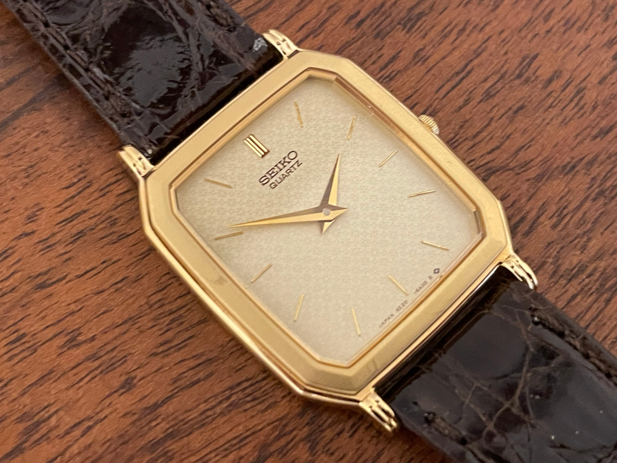 (1987) Seiko 5E20-5A00 "Tank" dress watch - champagne patterned dial w/ gold markers (NOS)