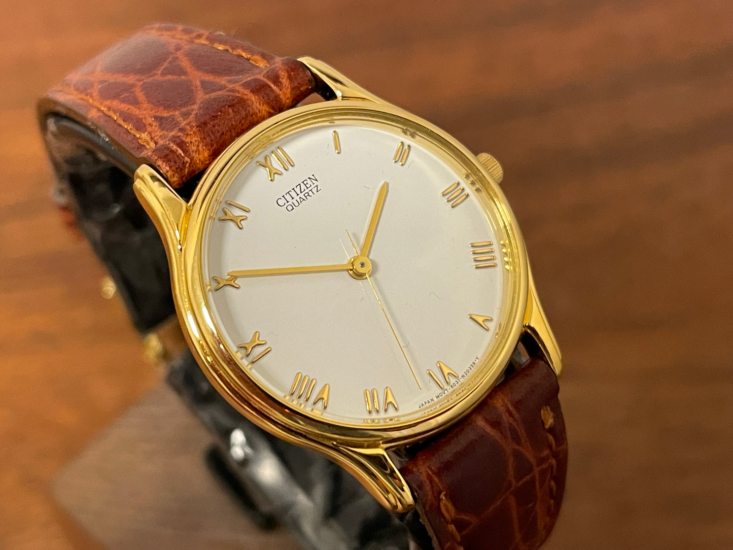 (1981) Citizen 6031-S38419 dress watch - white dial w/ gold Roman numerals - small size (NOS)