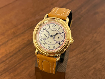 Front side (1988) Pulsar V336-7040 dress watch - gold colored case - creme dial w/ Arabic numerals