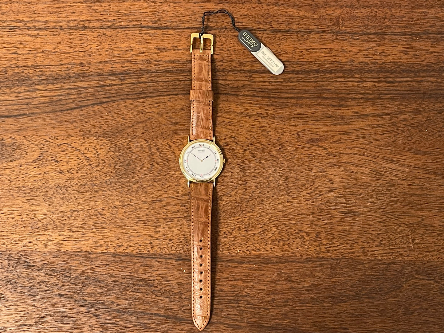 (1992) Seiko 7N00-6A00 dress watch - white dial w/ Roman numerals & Spade hands (NOS)